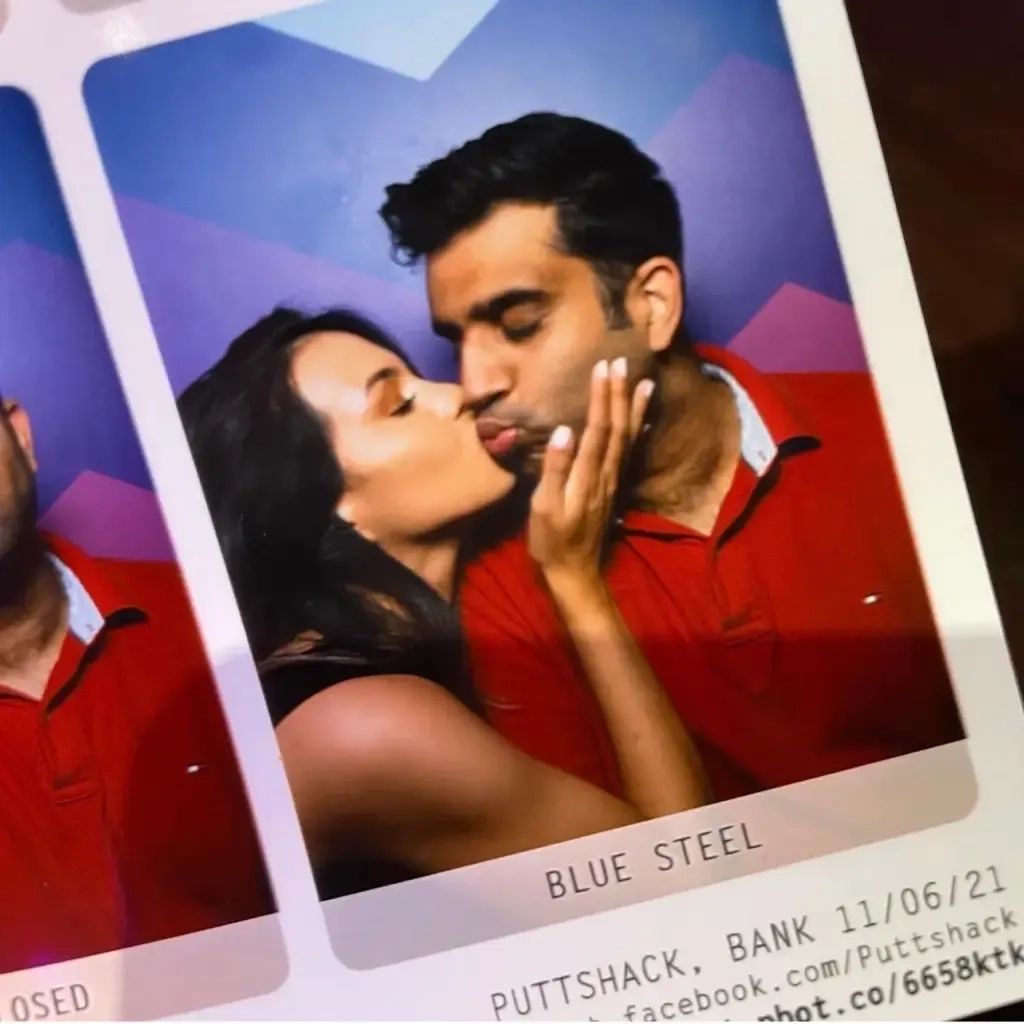 photobooth images of a happy couple smooching